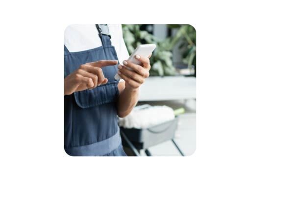 a worker holding her phone