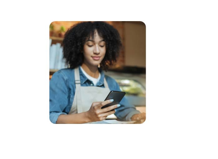 Training and Onboarding- woman looking at phone